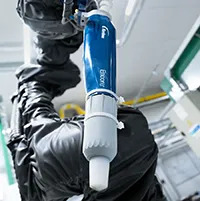 Nordson Encore powder coating gun mounted on robot GoFa