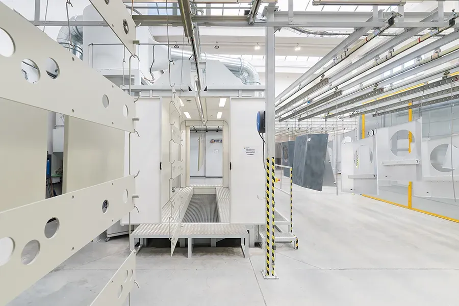 Manual coating booth with part in foreground