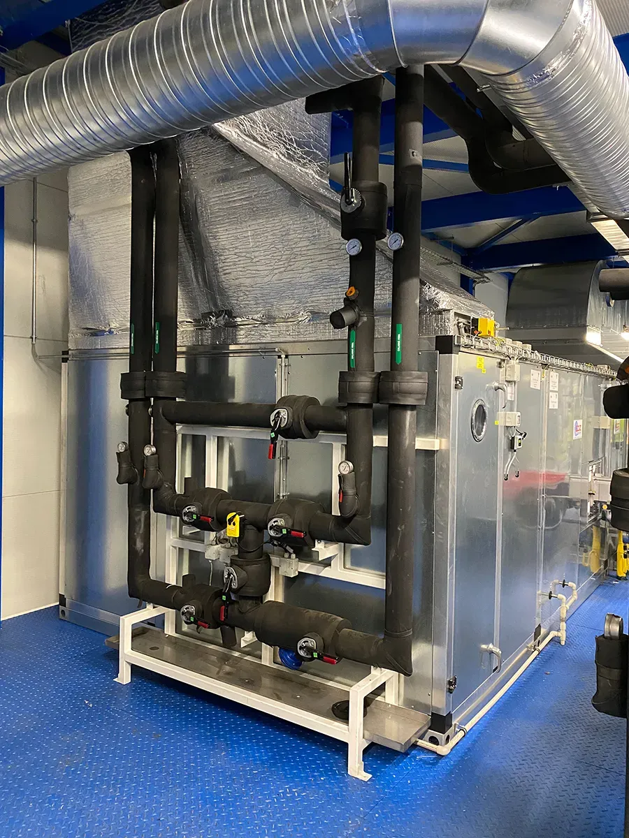 Black pipes connected to equipment 