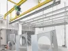 Metal parts hanging on a conveyor