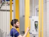 Worker operating Esco control system