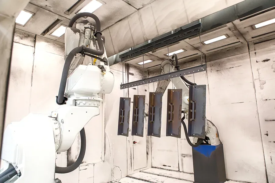 Metal parts inside automatic robotic booth