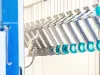 Metal parts in manual coating booth being coated