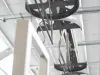 Metal parts on an overhead hanger in coating booth