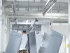 Parts finished coating on overhead conveyor