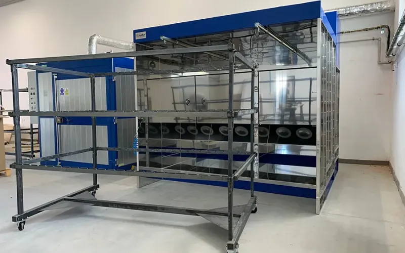 Powder coating booth with parts hanger