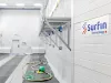 SURFIN Technology logo inside blasting chamber