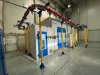 Coating line with an overhead conveyor