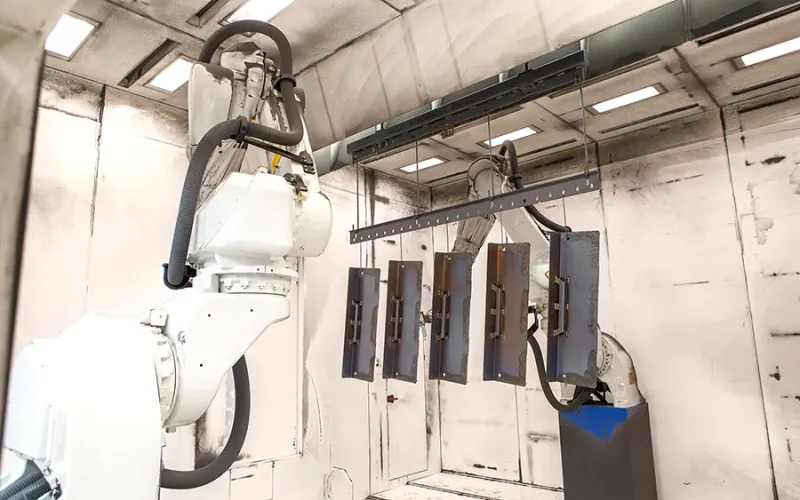 Metal parts inside automatic robotic coating booth