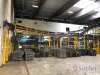 Overhead conveyor with parts in the foreground