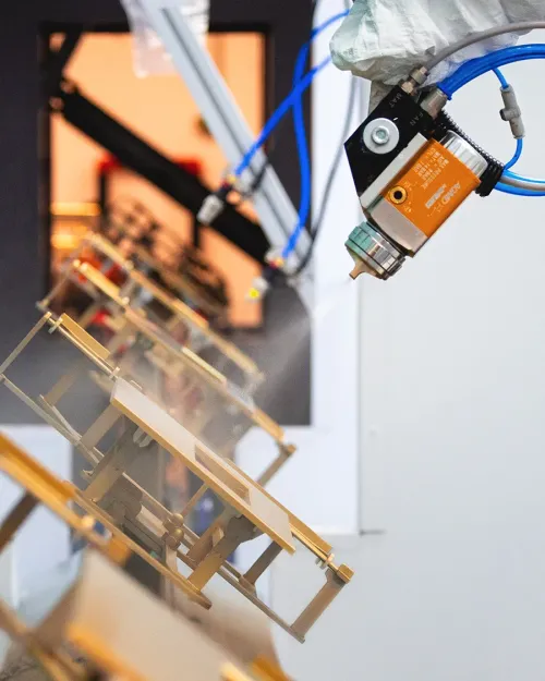 Robotic wet coating of plastic parts close-up