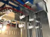 Metal parts on an overhead conveyor