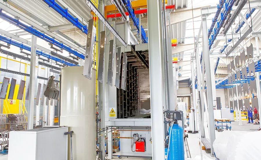 Metal parts entering two-stage pre-treatment