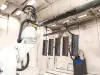 Metal parts inside automatic robotic booth