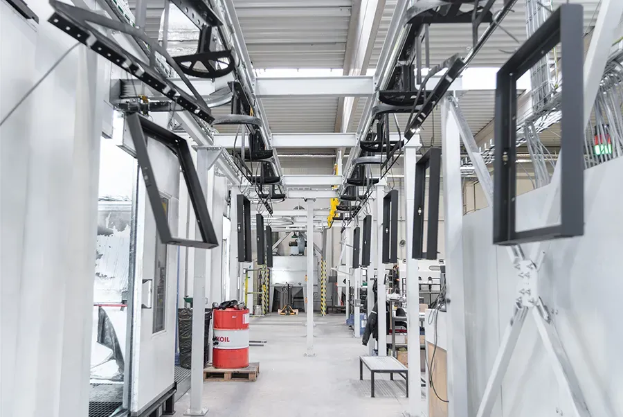 Metal parts hanged on overhead conveyor