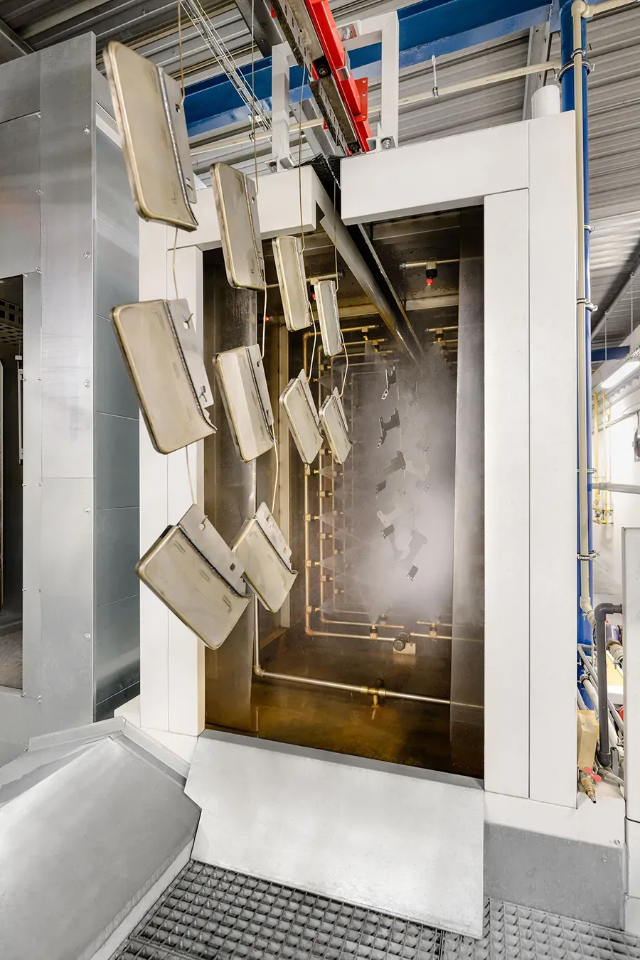 Metal parts in a chemical pretreatment chamber