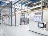Coating line with overhead conveyor