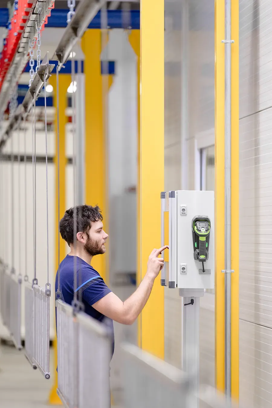 Worker operating Esco control system