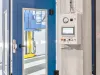 Coating booth panel with doors in background