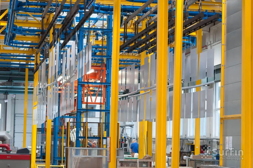 Parts on conveyor in coating facility